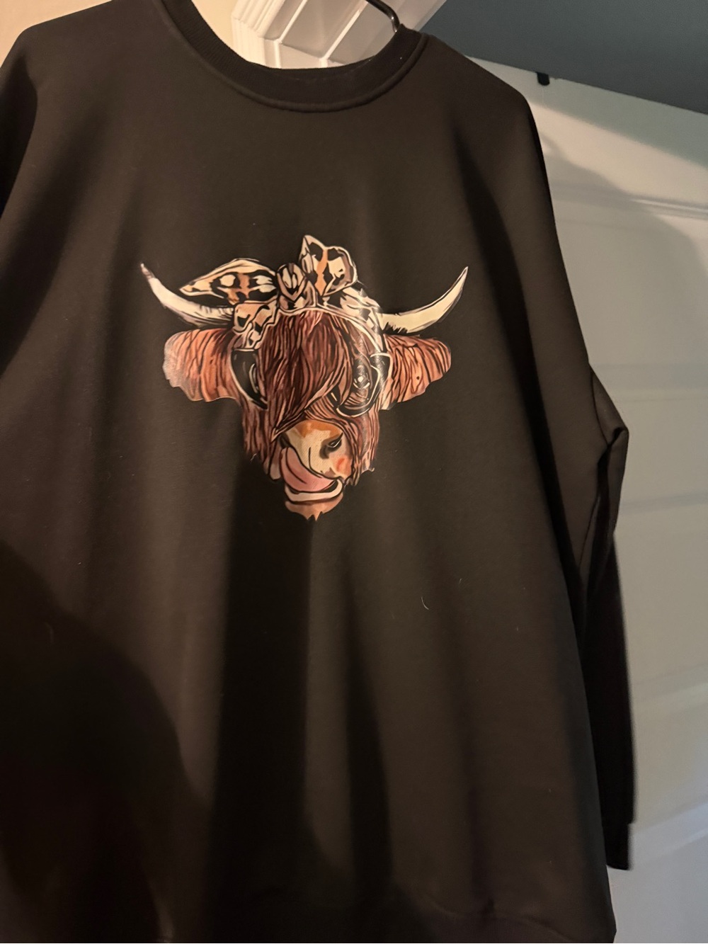 Black Sweatshirt with Cow Graphic